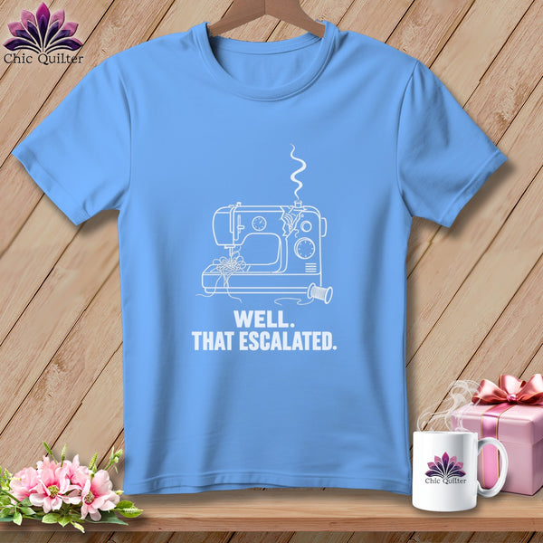 Light blue t-shirt with white line drawing of a sewing machine and text.