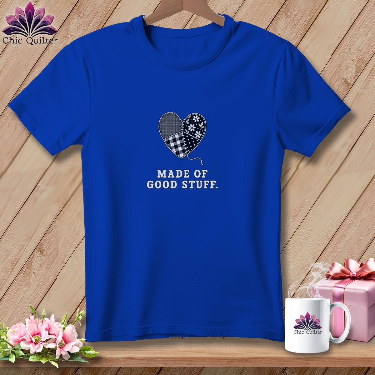 Blue t-shirt with a patchwork heart graphic and the text "MADE OF GOOD STUFF."