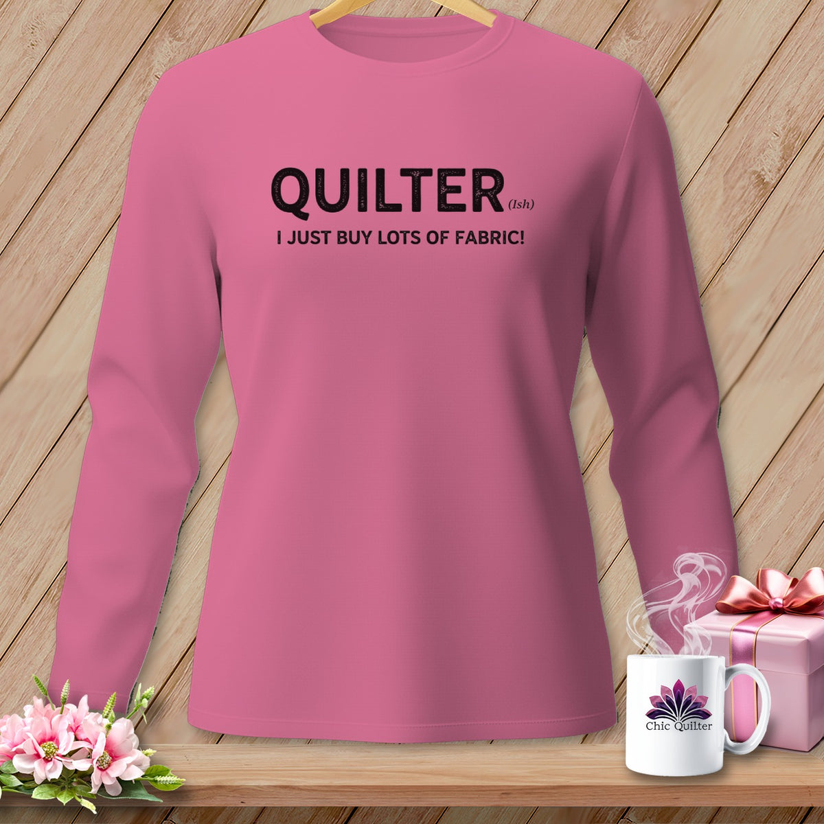 Pink long sleeve shirt with "QUILTER (ish) I JUST BUY LOTS OF FABRIC!" text.