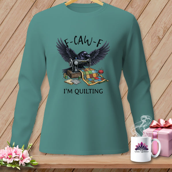 Teal long-sleeve shirt with raven, sewing machine, and quilt graphic reading "F-CAW-F I'M QUILTING".