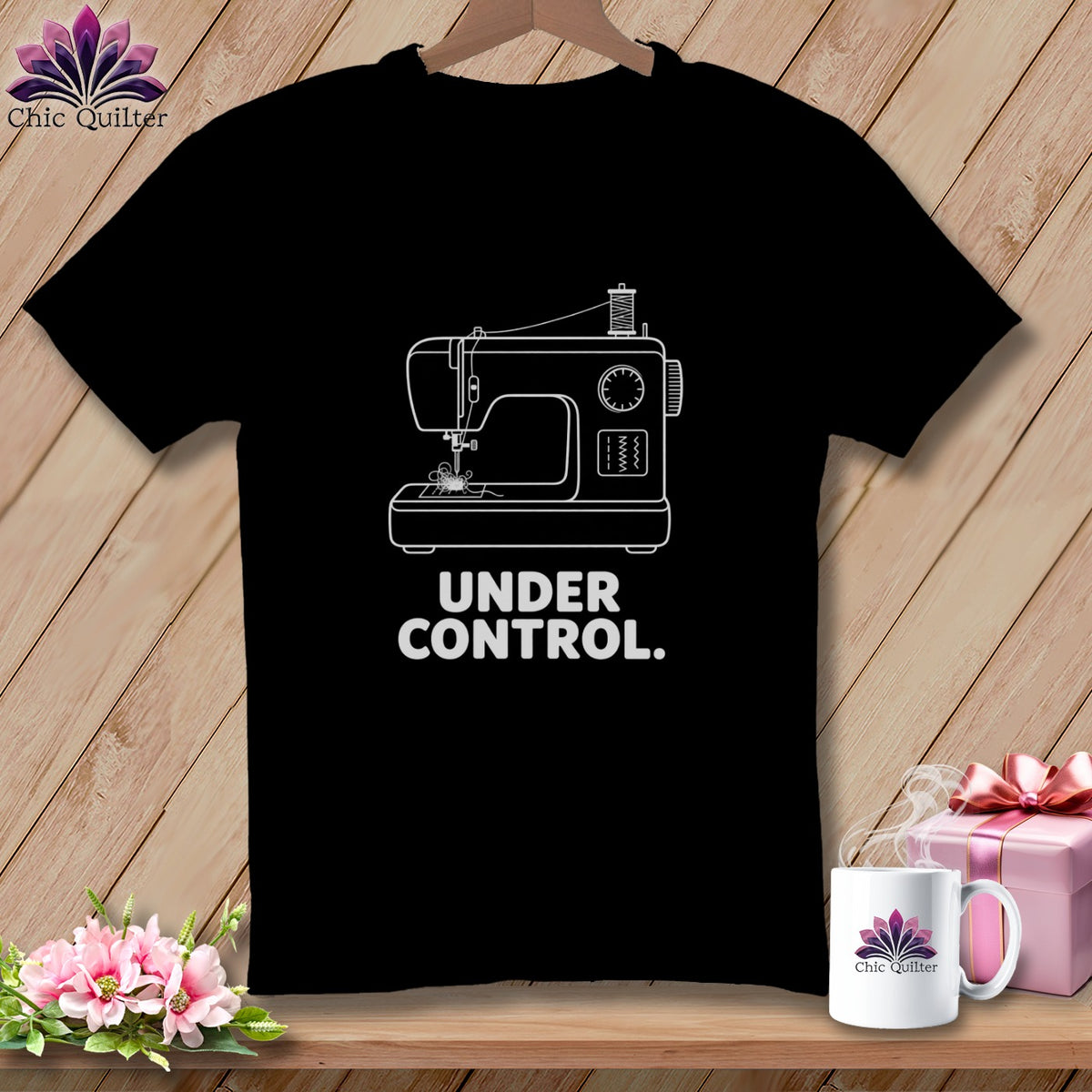 Black t-shirt with white sewing machine graphic and text "UNDER CONTROL."