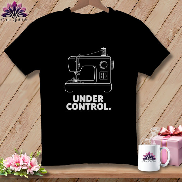 Black t-shirt with white sewing machine graphic and text "UNDER CONTROL."