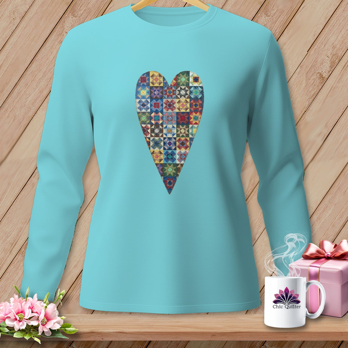 Aqua long-sleeve shirt with a patchwork heart graphic and "Chic Quilter" mug.