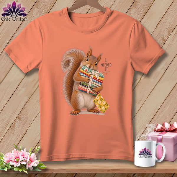 T-shirt with squirrel holding fabric stacks and text "I needed it."