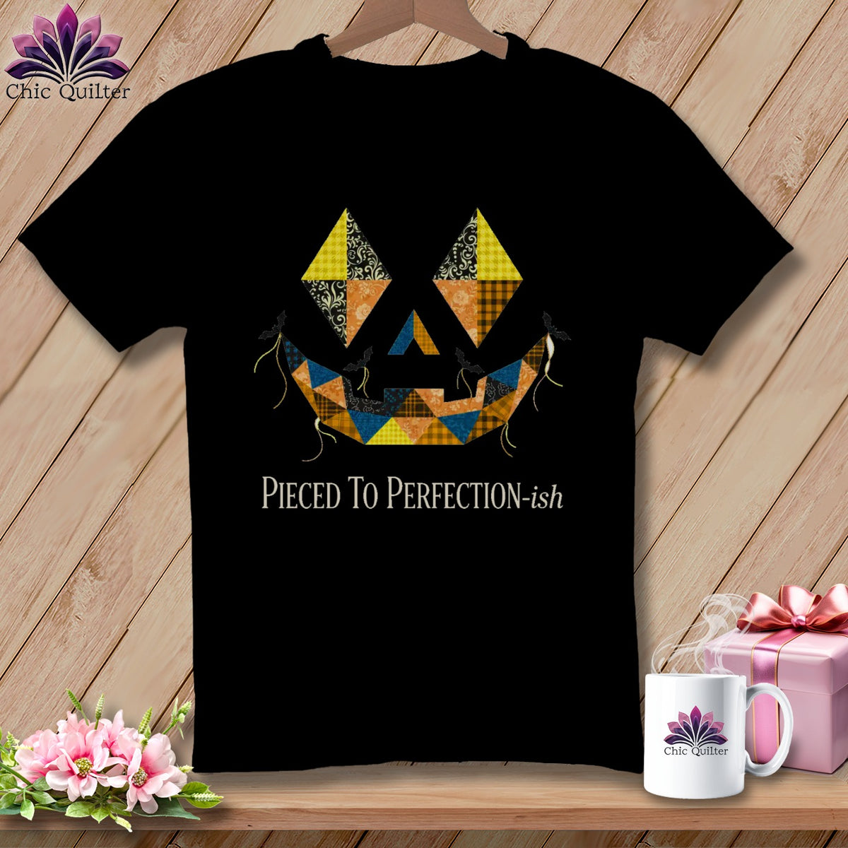Black t-shirt with patchwork jack-o'-lantern face and "Pieced To Perfection-ish" text.