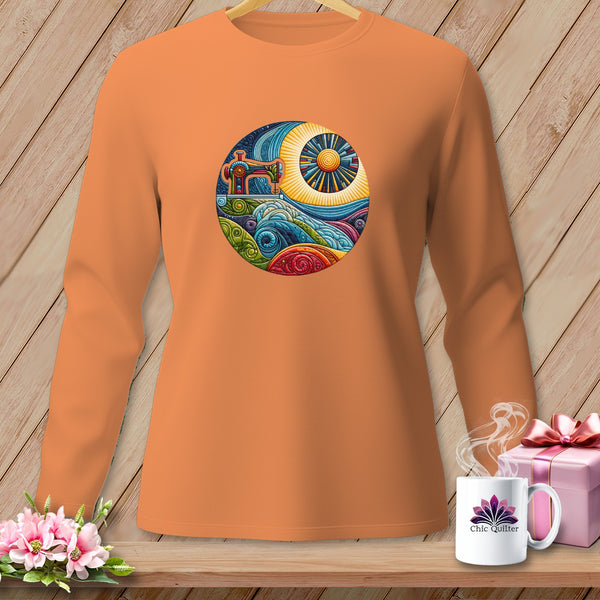 Orange long-sleeve shirt with a circular sewing machine and landscape graphic.