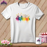 White t-shirt with watercolor sewing supplies and fabric scraps in rainbow colors.