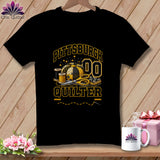 Black t-shirt featuring a yellow and black Pittsburgh Quilter graphic with a pincushion, scissors, and spools of thread.