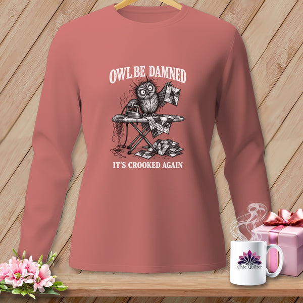 Long-sleeve shirt with a graphic of a distressed owl ironing a quilt, text "Owl Be Damned It's Crooked Again".