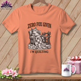 Peach t-shirt with a fox on a chair, sewing machine, and text 