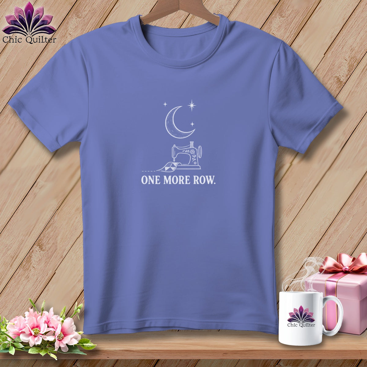 Purple t-shirt with sewing machine, moon, stars, and text "ONE MORE ROW."