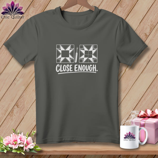 Dark grey t-shirt with white quilt block graphic and "CLOSE ENOUGH" text.
