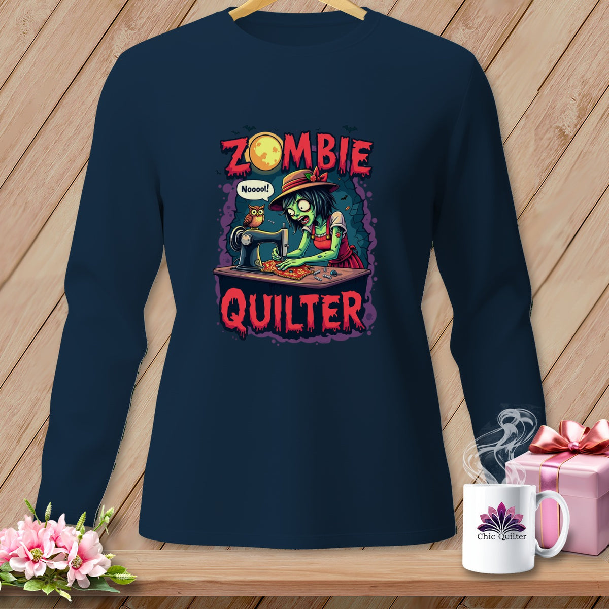 Dark navy long sleeve shirt with cartoon zombie quilter text graphic.