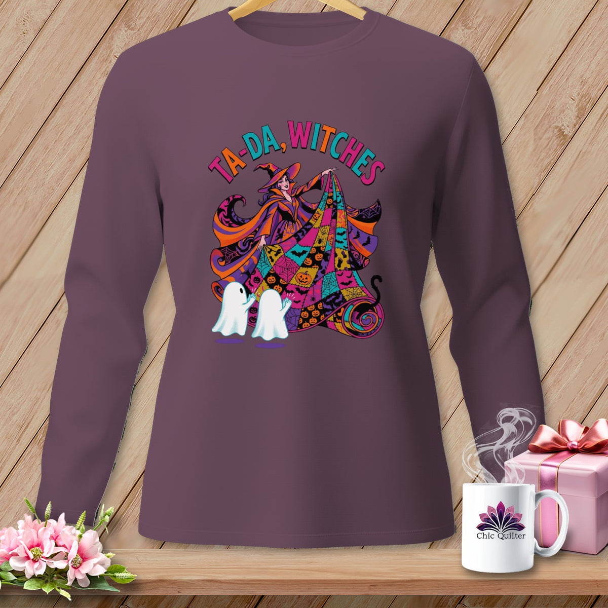 Long sleeve shirt with witch and ghosts Halloween graphic that says "Ta-da, Witches".