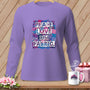 Long-sleeve lavender shirt with "Peace Love and Fabric" text on a colorful patchwork background.