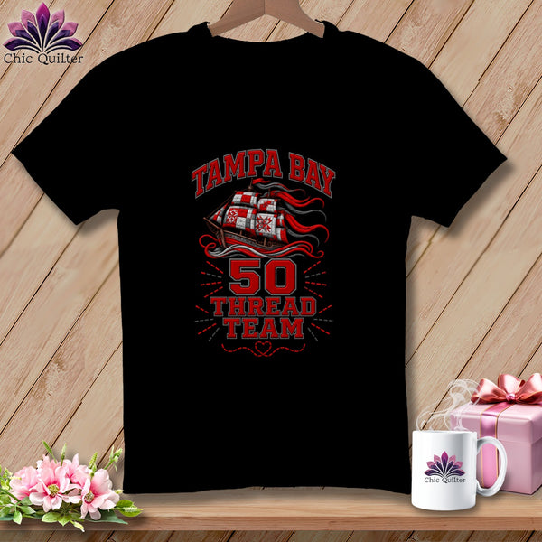 A black t-shirt features a red and white sailing ship graphic with text reading Tampa Bay 50 Thread Team.