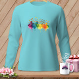 Teal long-sleeve shirt with watercolor sewing notions and rainbow fabric splashes.