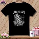 Black t-shirt with a drawing of a fox sewing, text says 