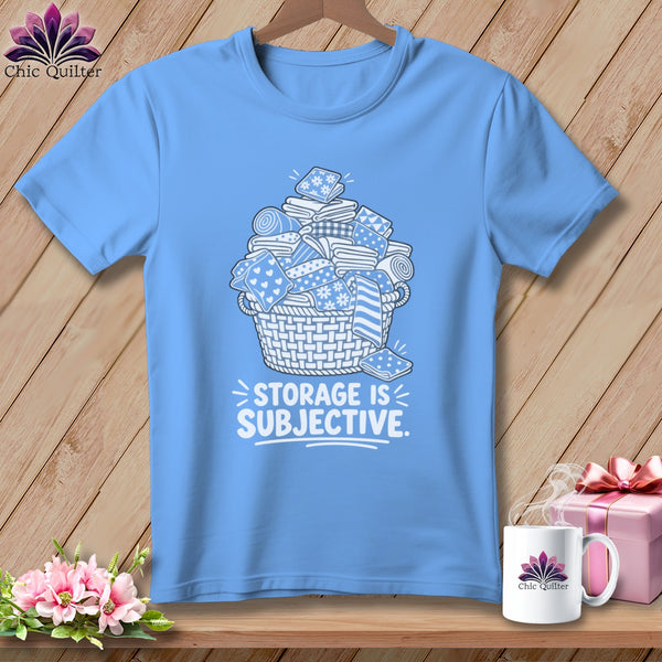 Light blue t-shirt with a basket of fabric and the text "STORAGE IS SUBJECTIVE."