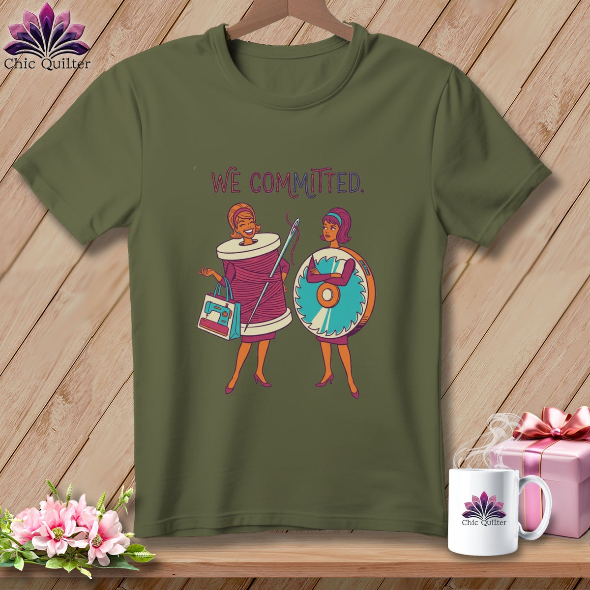 Green t-shirt with "WE COMMITTED." text and cartoon sewing theme.