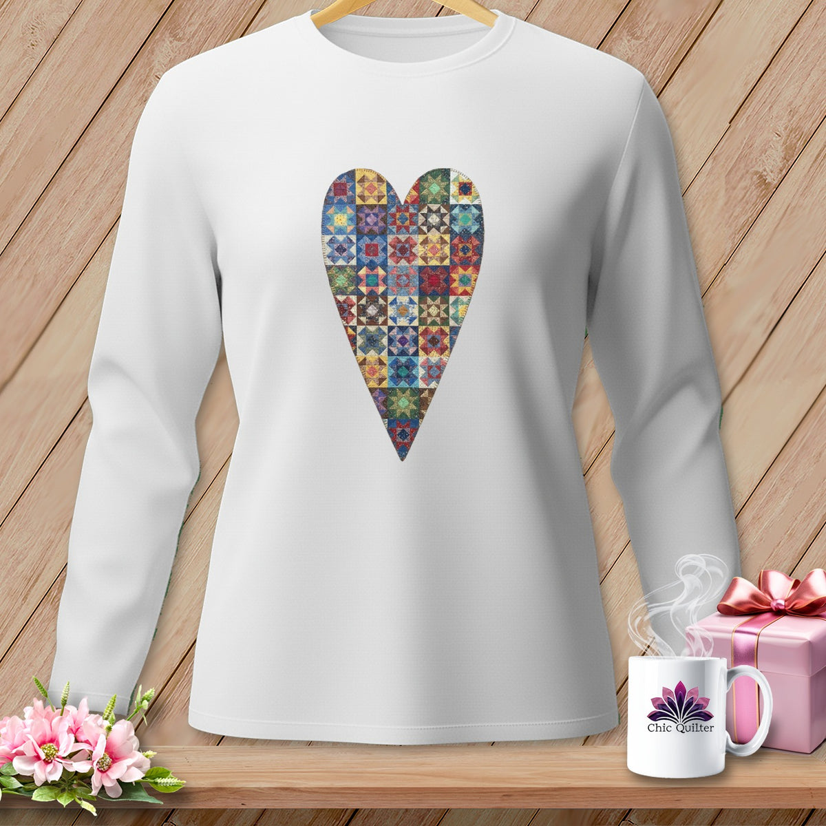 White long-sleeve shirt with a patchwork quilt heart graphic.