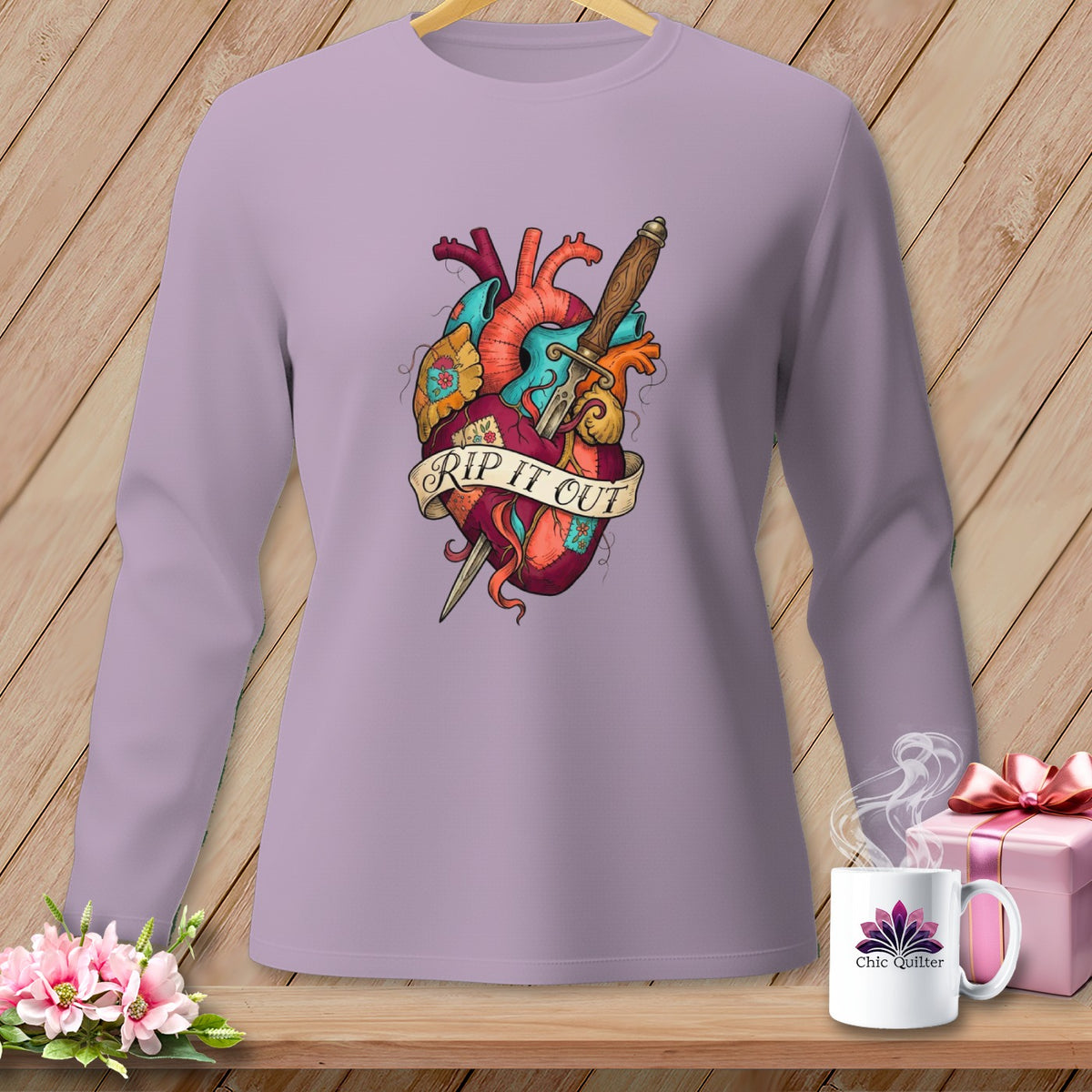 Long-sleeve shirt with a dagger through a heart graphic that reads "RIP IT OUT".