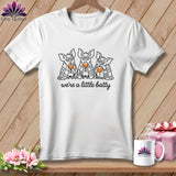 White t-shirt with three bats in blankets holding wine glasses, text 