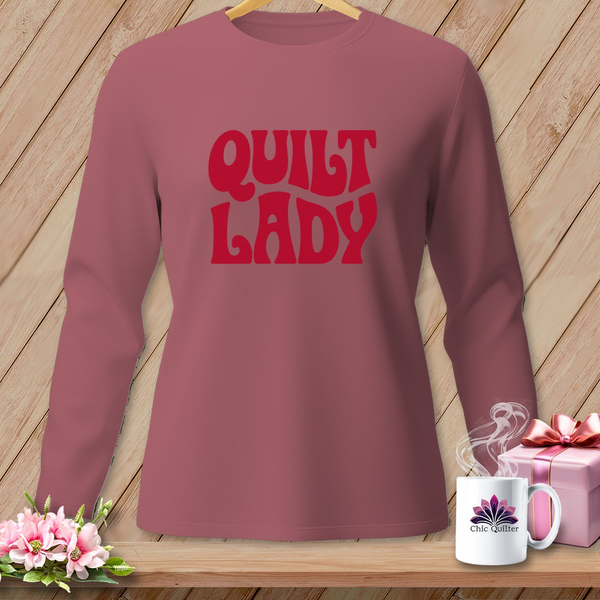 Rose-colored long-sleeved shirt with "QUILT LADY" text and a mug.