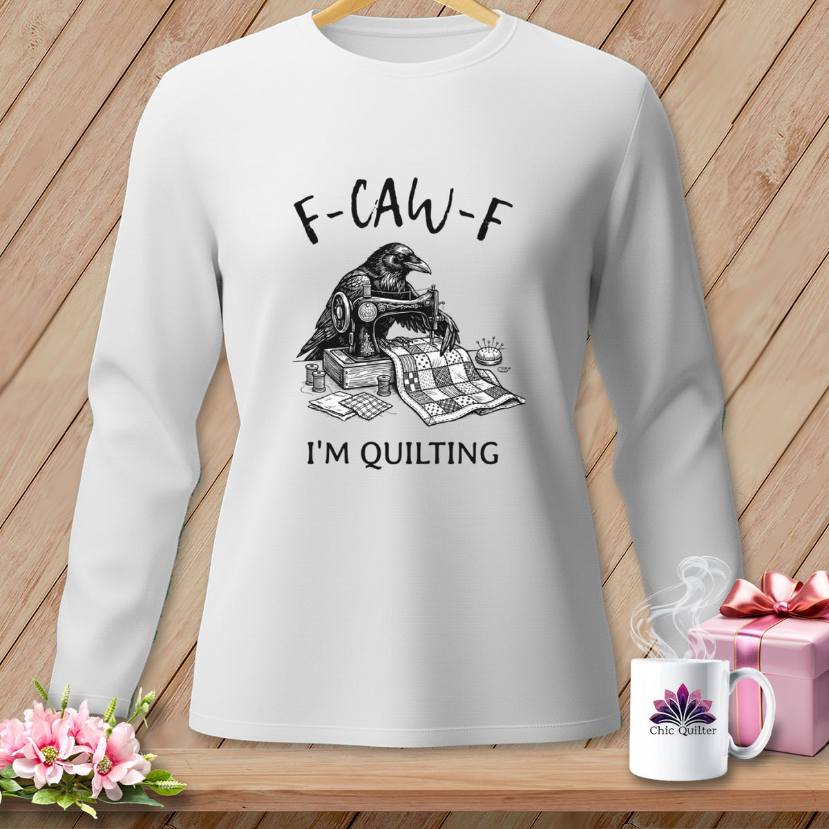 White long-sleeve shirt with crow sewing quilt, text "F-CAW-F I'M QUILTING".