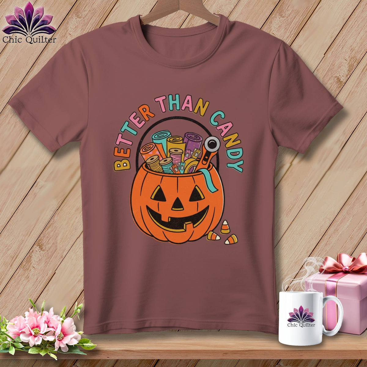 T-shirt with pumpkin graphic, "Better Than Candy" text, and sewing supplies.