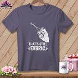 T-shirt with white graphic of hand holding scissors cutting fabric and text 