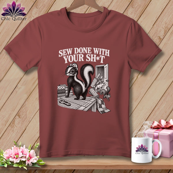 Skunk on cutting mat with sewing supplies, text "Sew Done With Your Sh*t".