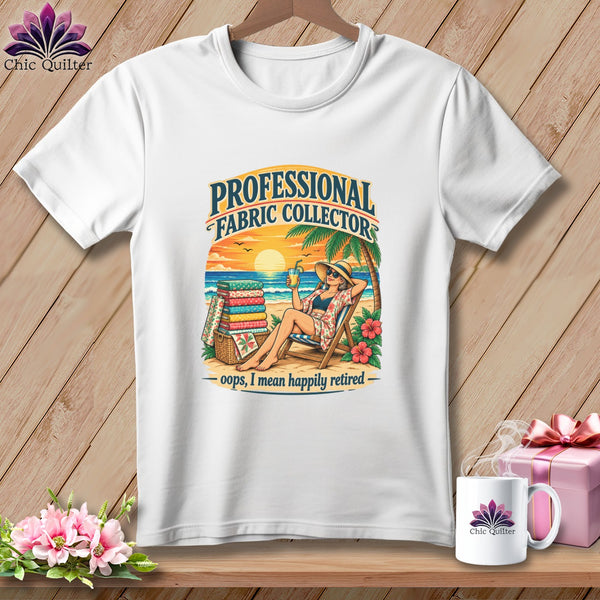 White t-shirt with a beach graphic that says Professional Fabric Collector, Oops, I Mean Happily Retired.