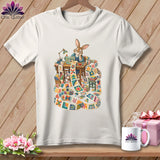 T-shirt with a rabbit sewing a quilt, surrounded by fabric scraps.