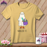 Yellow t-shirt with a cartoon ghost holding craft supplies and the text 