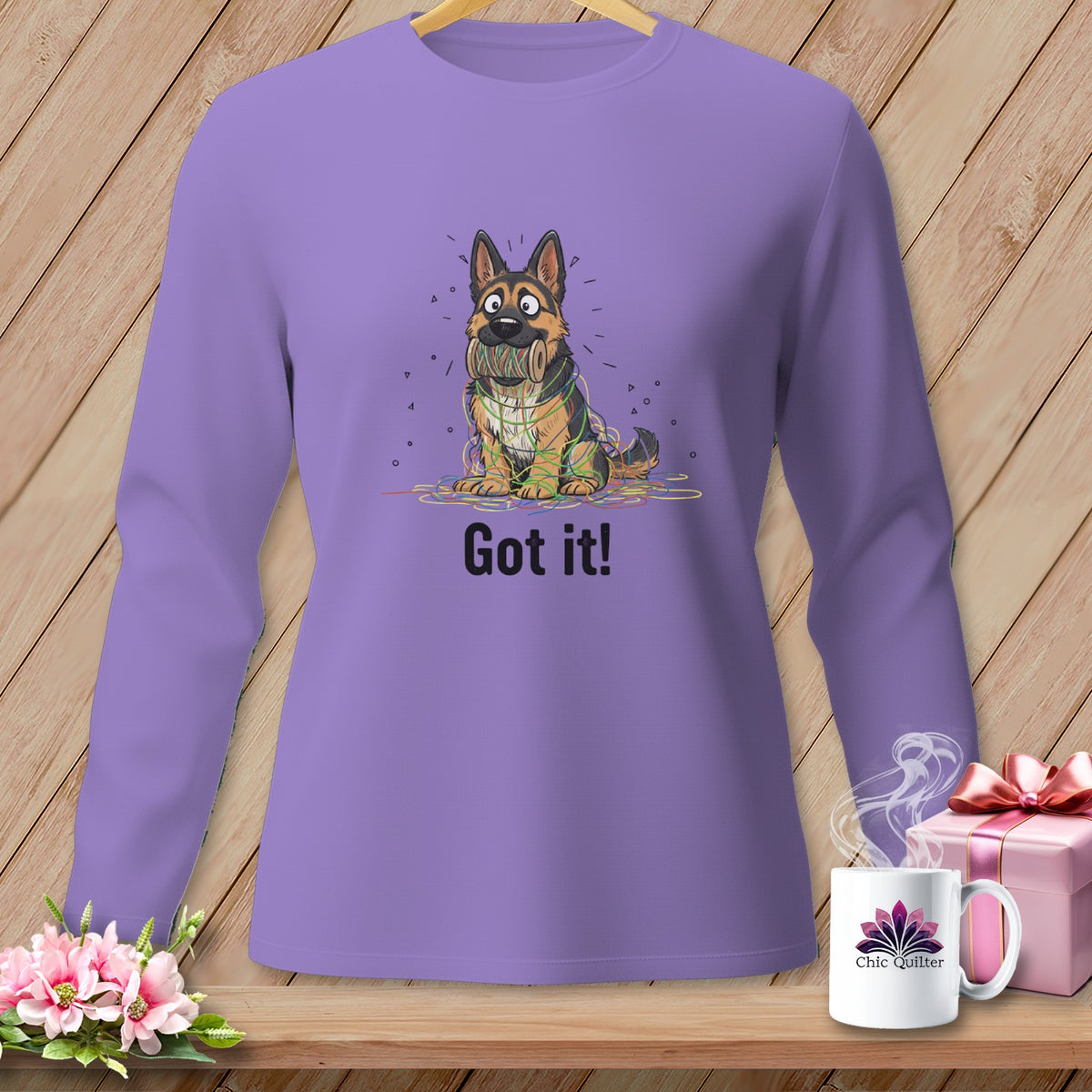 Long sleeve purple shirt with cartoon German Shepherd tangled in colorful yarn, text "Got it!"
