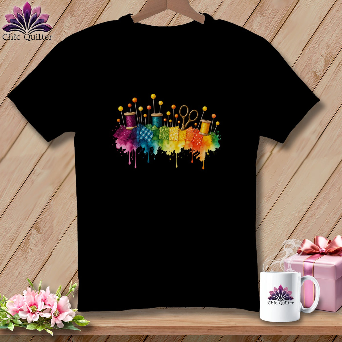 Black t-shirt with colorful sewing supplies and rainbow watercolor splash design.