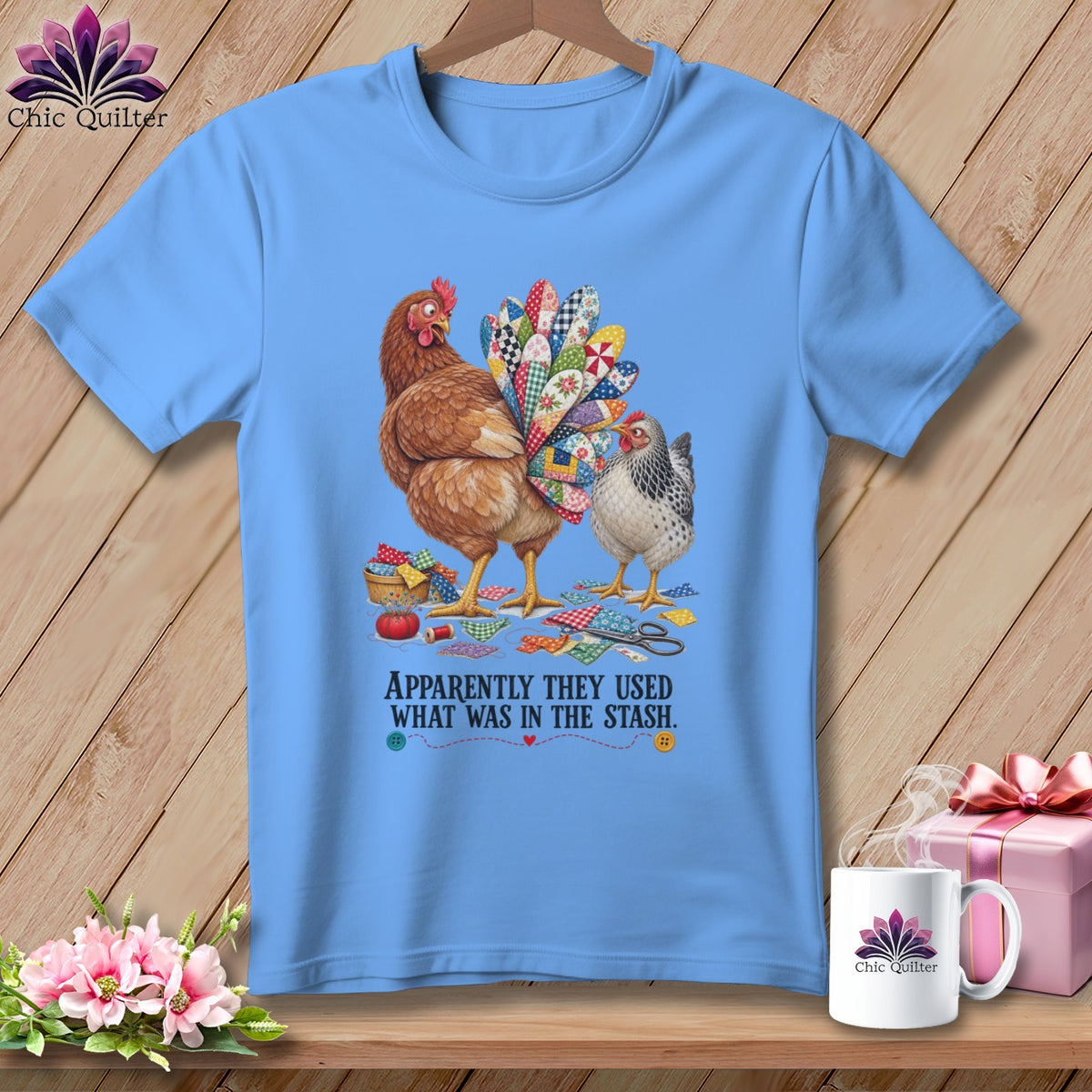 Light blue t-shirt with two chickens and patchwork tail, text reads "APPARENTLY THEY USED WHAT WAS IN THE STASH."