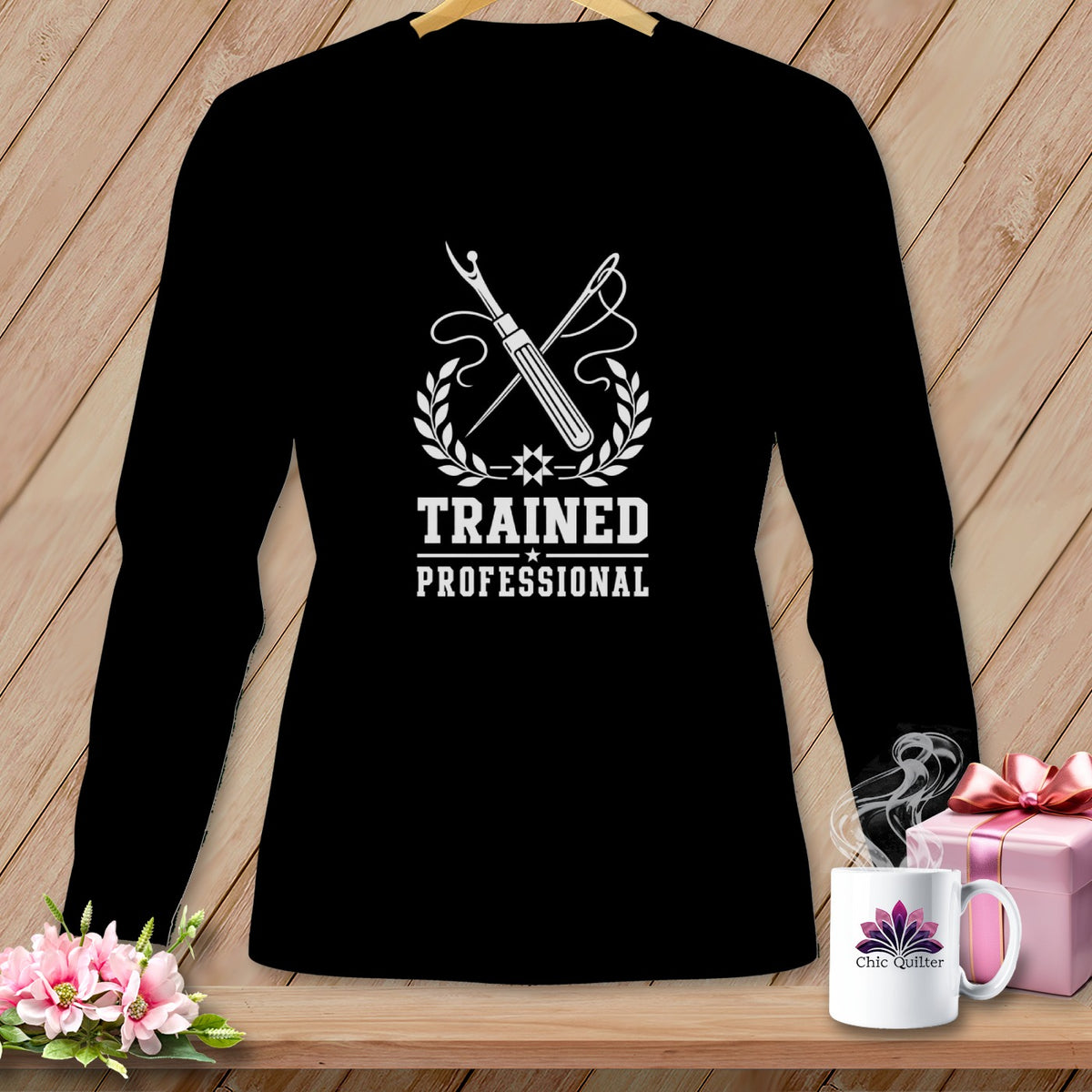 Black long-sleeve shirt with "Trained Professional" and sewing tools graphic.