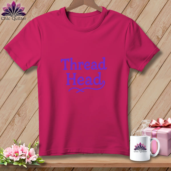 Fuchsia t-shirt with "Thread Head" text and decorative flourish.