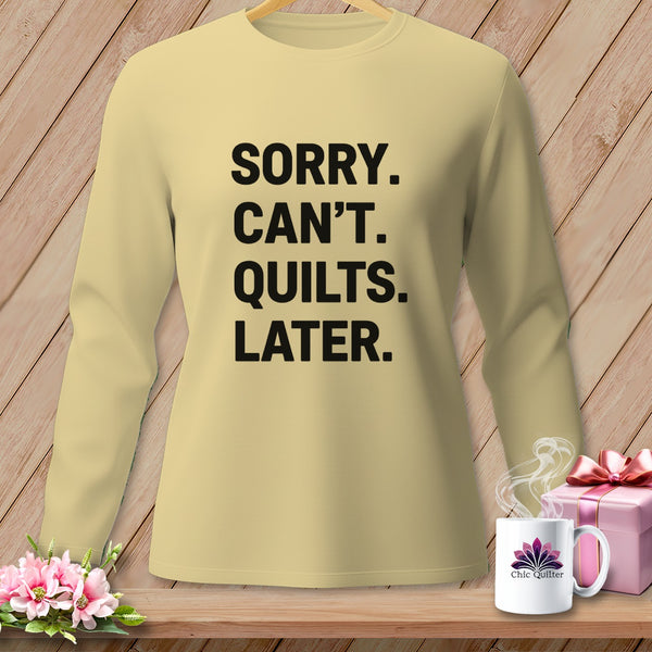 Light yellow long-sleeve shirt with black text reading "SORRY. CAN'T. QUILTS. LATER."