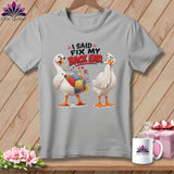 Two cartoon geese on a grey t-shirt, one with a patchwork pincushion body.