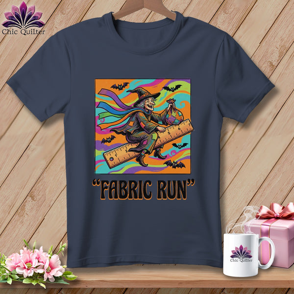 A witch on a ruler holds a fabric bag, with bats and the text "Fabric Run".