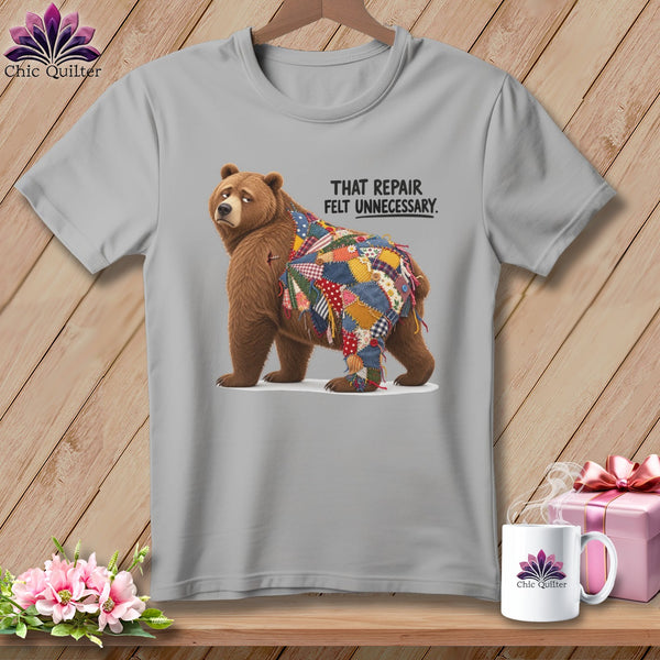 Bear with a patchwork quilt covering its back and text "THAT REPAIR FELT UNNECESSARY."