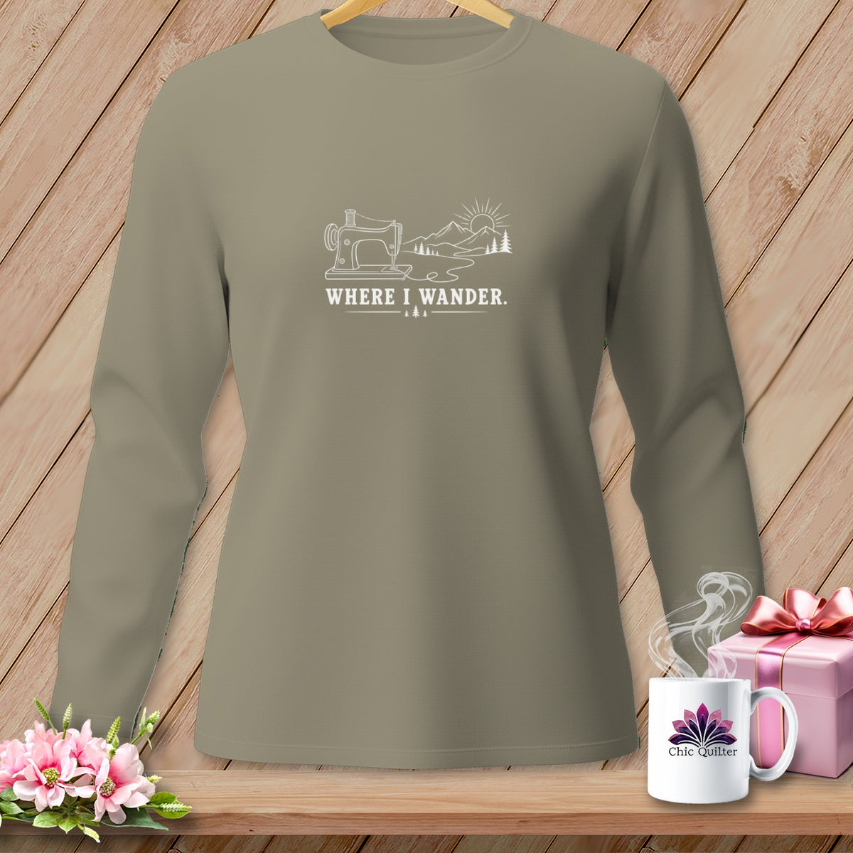 Long sleeve shirt with sewing machine, mountains, and "Where I Wander" text.