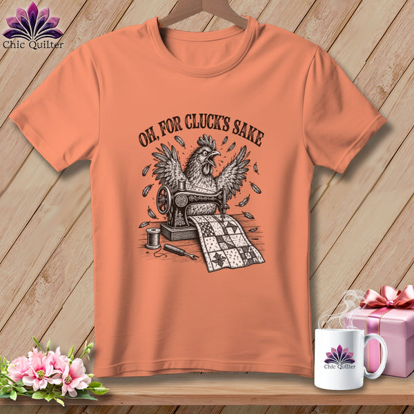 Peach t-shirt with a chicken, sewing machine, quilt, and the text "OH, FOR CLUCK'S SAKE".