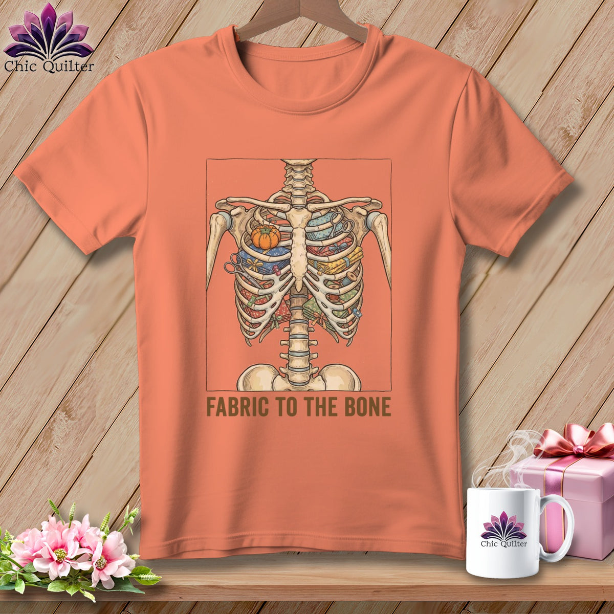 Skeleton torso graphic with fabric, scissors, and pumpkin, text "FABRIC TO THE BONE".