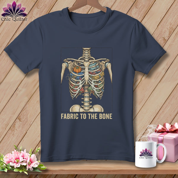 Skeleton with sewing supplies inside its ribcage and the text "Fabric to the Bone."