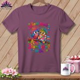 A mauve t-shirt features a colorful graphic of two owls and the text Whooo Needs a Seam Ripper? We Do.