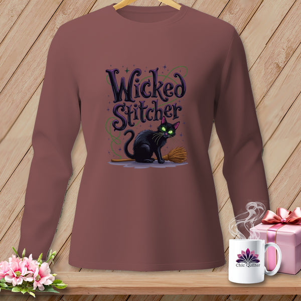 Brown long-sleeve shirt with a black cat and broom graphic and "Wicked Stitcher" text.